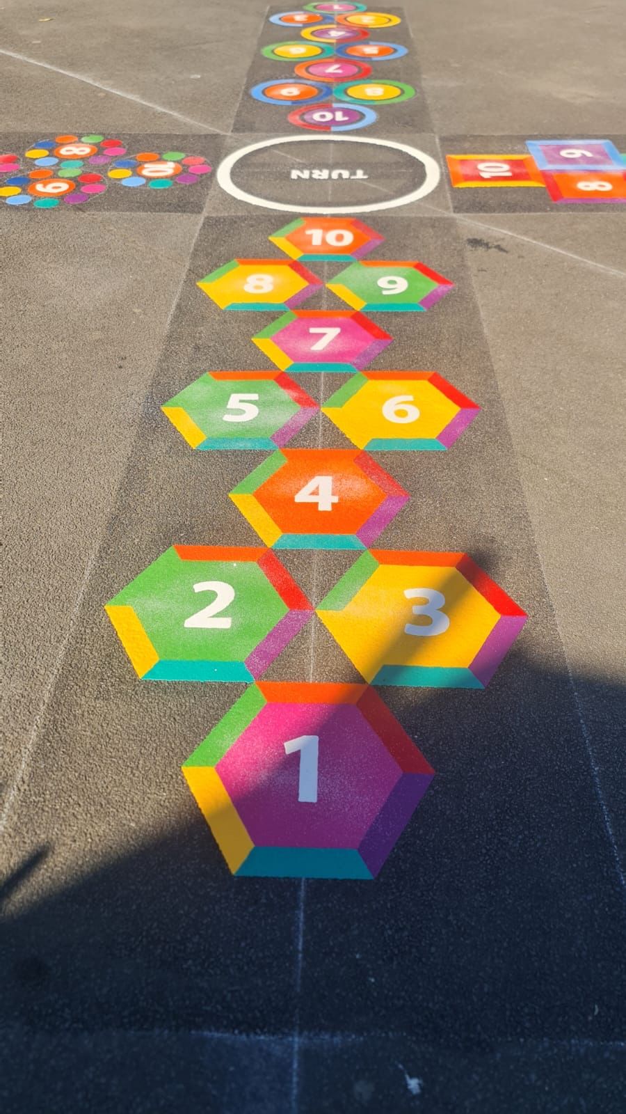 Hexagon & trail hopscotch playground markings by Commercial Play